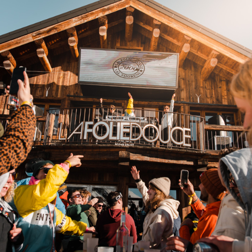 people dancing at an outdoor apres-ski party at La Folie Douce